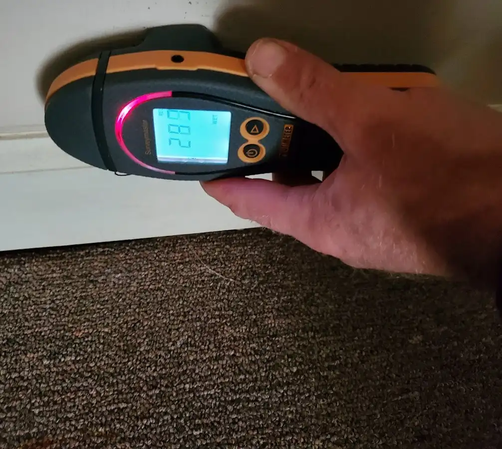 Moisture detection at baseboard during Storm Damage Restoration in Fort Mill